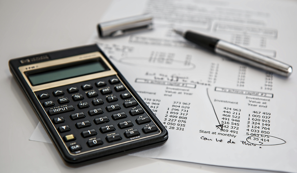 Calculator and data sheet showcasing trust accounting calculations for vacation rentals.